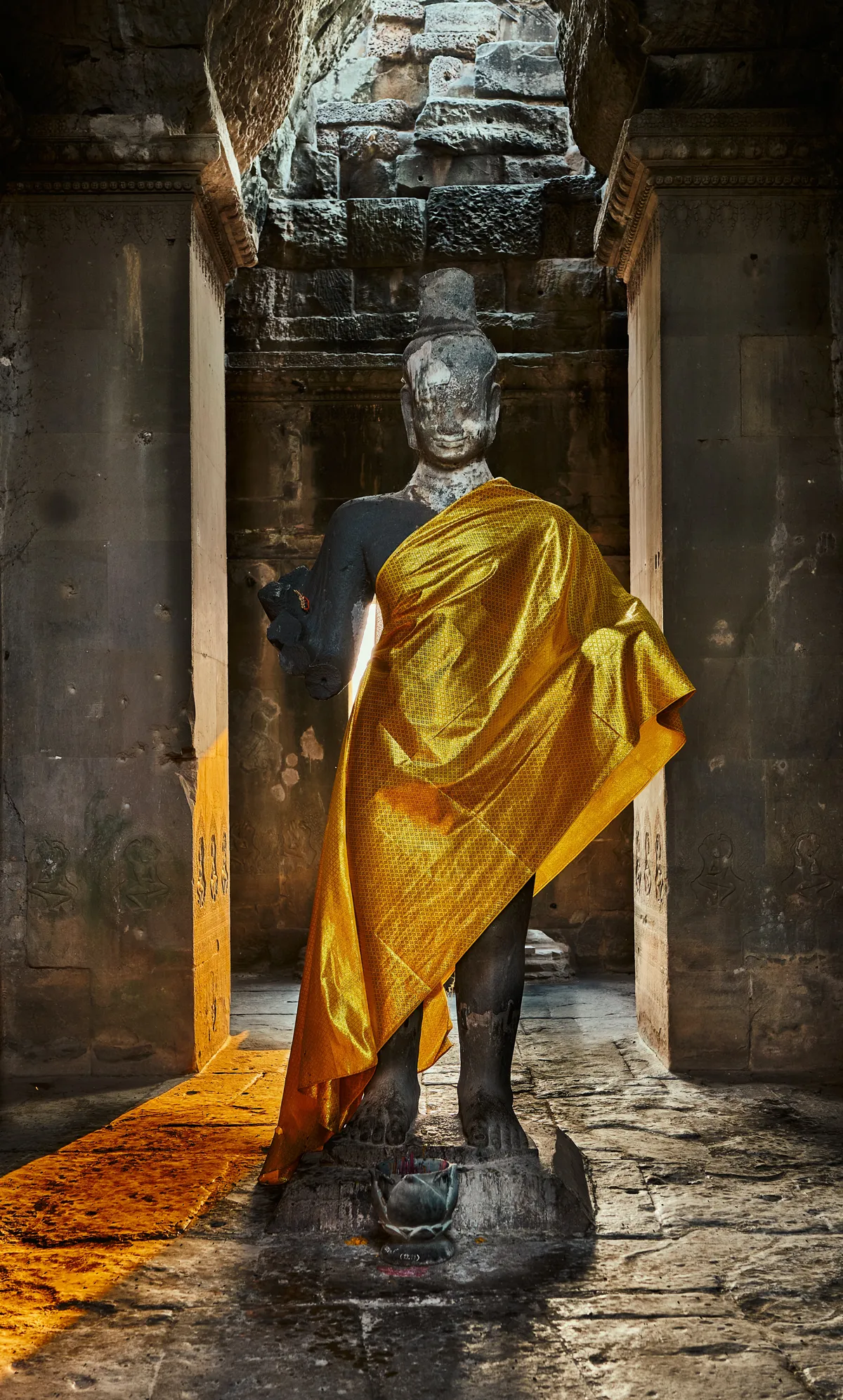 buddha statue with yellow belt